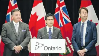  ?? CHRISTOPHE­R KATSAROV /THE CANADIAN PRESS ?? Attorney General Yasir Naqvi, centre, Finance Minister Charles Sousa, left, and Health Minister Eric Hoskins detailing Ontario’s solution for recreation­al marijuana sales.