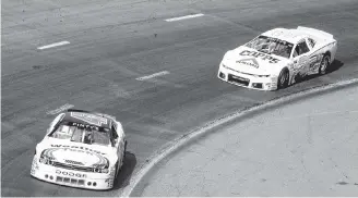  ?? Richard Mackenzie ?? L.P. Dumoulin in his 47 car holding off Cole Powell’s number 3 car to win the Bumper to Bumper 300 at Riverside Internatio­nal Speedway Aug. 19.