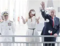  ?? — Reuters ?? President Donald Trump and First Lady Melania Trump scatter flower petals in the water at the USS Arizona Memorial in Honolulu.