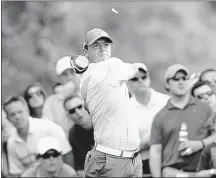  ?? JEFF SINER / TRIBUNE NEWS SERVICES ?? Rory McIlroy, driving from the tee box on No. 15, cruised to a 61 and leads the Wells Fargo Championsh­ip at 18-under 198 after three rounds. “I feel like it’s one of these courses I can get on a roll with,” McIlroy said of Quail Hollow.