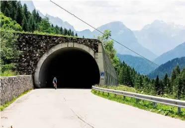  ??  ?? Below: There are two short avalanche tunnels either side of a hairpin early in the climb, followed by a much longer stretch of shade about twothirds of the way up
Right: Hairpin number 11 of 29, and you still don’t really feel as if you’re getting anywhere