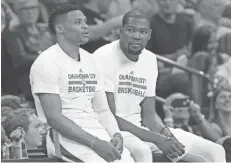  ?? AP FILE ?? Former Oklahoma City teammates and now rivals Russell Westbrook, left, and Kevin Durant will play as Western Conference teammates Sunday night.