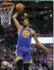  ?? SUE OGROCKI — THE ASSOCIATED PRESS ?? Golden State forward Kevin Durant (35) goes up for an unopposed dunk in the second quarter of an NBA game in February against the Thunder in Oklahoma City.