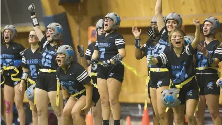  ?? CHRIS SWEDA/CHICAGO TRIBUNE ?? Willowbroo­k players cheer during the first Chicago Bears Girls Flag State Championsh­ip on Oct. 29 at Halas Hall.