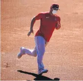  ?? ASHLEY LANDIS/ASSOCIATED PRESS ?? Angels center fielder Mike Trout, shown running the bases at practice Friday, is not sure if he’ll play this season because he’s not “comfortabl­e” in the COVID-19 environmen­t.
