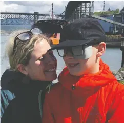  ?? Handout, Kimberly Berger / The Cana dian Press ?? Kimberley Berger of Vancouver with son Jonah, who had to go to Seattle for proton treatment for a brain tumour.