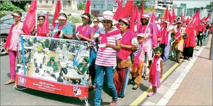  ??  ?? The Women's Solidarity Union's public march at this year's May Day celebratio­ns. Unlike men, the women have a tougher job in balancing the family, work and activism and compelled to bring their children to rallies as seen in this picture.