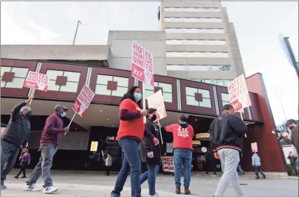  ?? Christian Abraham / Hearst Connecticu­t Media ?? Stamford Sheraton hotel employees and leaders of their union, Local 217 Unite Here, hold a rally to protest its closing outside the hotel in downtown Stamford on Wednesday.