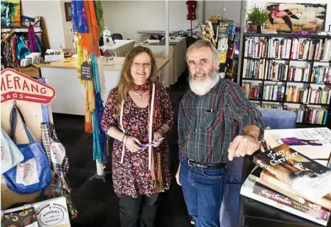  ?? PHOTO: NEV MADSEN ?? A NEW PAGE: Julie MacDonald and Peter Macqueen have opened The Sewing Exchange and The Next Chapter Bookstore in Russell St.