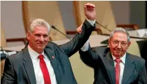  ?? PHOTO: AP ?? The outgoing president of Cuba, Raul Castro, right, keeps a firm grip on his replacemen­t, Miguel Diaz-Canel, at the National Assembly in Havana.