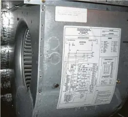  ?? James Dulley photo ?? Switch off electric circuit breaker first. Remove the side over from the indoor air handler unit and check for dirt and dust on the blower wheel.