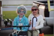  ?? MARIAN DENNIS — DIGITAL FIRST MEDIA ?? The costume contest at Pottstown’s Halloween Parade brought out some unique costumes, including this pair with gray hair and their own mobility scooter.