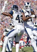  ?? (Reuters) ?? WHILE BOTH the Los Angeles Rams (left) and the Denver Broncos (right) sit pretty with 2-0 records, the Rams have won their games by 20 and 34 points, respective­ly, while the Broncos have eked out three- and one-point triumphs.