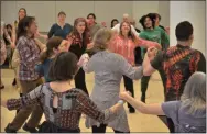  ?? LAUREN HALLIGAN - MEDIANEWS GROUP ?? Attendees dance to folk music at the 33rd annual Flurry Festival on Sunday in Saratoga Springs.