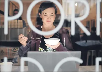  ??  ?? A customer enjoys a bowlful at Britain’s first specialist porridge cafe in London’s trendy Shoreditch