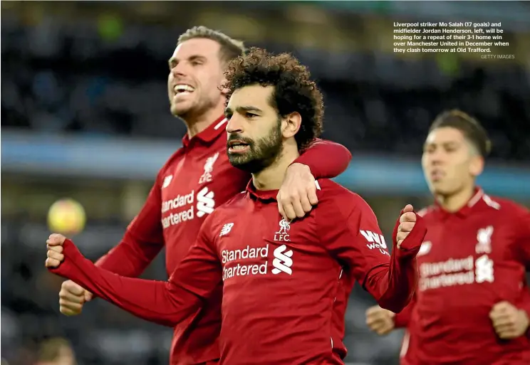  ?? GETTY IMAGES ?? Liverpool striker Mo Salah (17 goals) and midfielder Jordan Henderson, left, will be hoping for a repeat of their 3-1 home win over Manchester United in December when they clash tomorrow at Old Trafford.