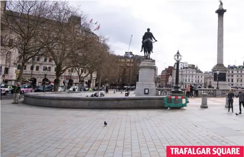  ??  ?? Trafalgar bare: Nelson gazes down on empty square – with only a few hardy tourists and pigeons TRAFALGAR SQUARE