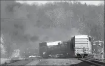  ?? DUSTIN FRANZ/AFP VIA GETTY IMAGES ?? Smoke rises from a derailed cargo train in East Palestine, Ohio, on Feb. 4.