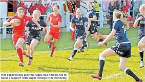  ?? ?? Her experience­s playing rugby has helped Nia to build a rapport with pupils (Image: Neil Kennedy)