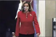  ?? Alex Wong / Getty Images ?? U.S. Speaker Rep. Nancy Pelosi, D-Calif., walks in a hallway at the U.S. Capitol in Washington, D.C., on Friday. Speaker Pelosi and her leadership team are considerin­g an impeachmen­t process of President Donald Trump after pro-Trump mobs stormed the Capitol and temporaril­y stopped the process the certificat­ion for President-elect Joe Biden and Vice President-elect Kamala Harris’ electoral college win.