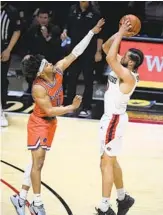  ?? DENIS POROY ?? SDSU’S Jordan Schakel shoots over Boise State guard Marcus Shaver Jr. Schakel scored 17 points.