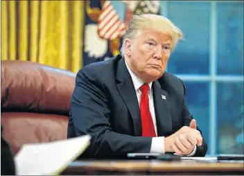  ?? AP PHOTO ?? President Donald Trump listens to a question during an interview with The Associated Press in the Oval Office of the White House, Tuesday, in Washington.