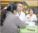  ?? CONTRIBUTE­D 2014 ?? Seton Healthcare staff has regularly offered free health screenings, including events such as the Vietnamese Health Fair at Lanier High.