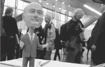  ?? PAUL CHIASSON/ THE CANADIAN PRESS ?? A bobblehead of late NDP leader Jack Layton sits on a table at the NDP’s weekend convention Friday at Palais des congrès in Montreal. The official Opposition party gave current leader Tom Mulcair a resounding vote of confidence.