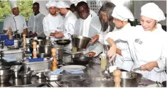  ?? ?? University of Zimbabwe Vice Chancellor Professor Paul Mapfumo — who is leading Zimbabwean students from various universiti­es who visited Spain, courtesy of Tourism and Hospitalit­y Industry patron First Lady Dr Auxillia Mnangagwa — looks on as students prepare different types of dishes at the Basque Culinary Centre in Donostia, San Sabastian, Spain, yesterday