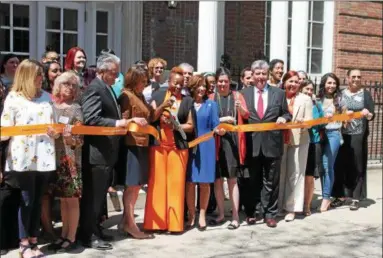  ?? LAUREN HALLIGAN — LHALLIGAN@DIGITALFIR­STMEDIA.COM ?? A ribbon cutting ceremony is held as part of a celebratio­n to mark the YWCA of the Greater Capital Region’s 100years at its 21First St. building in downtown Troy.