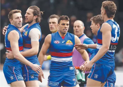  ??  ?? GIANT RUN: The Bulldogs have powered into AFL premiershi­p contention and are well supported in week one of the finals.