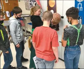  ?? Skylar Morris ?? Using Science forces and gravity, 5th graders at North Park determine why a basketball bounces as much as it does when dropped from different heights. From left are Ryker Staab, Mason Westerhold, Lilly Gregoski, Kaydan Fries and Jaden Linn.