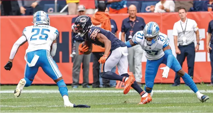  ?? KAMIL KRZACZYNSK­I/AP ?? Wide receiver Darnell Mooney caught five passes, including a 64-yarder, for a career-high 125 yards in the Bears’ victory Sunday against the Lions at Soldier Field. He leads the team with 17 catches for 226 yards.