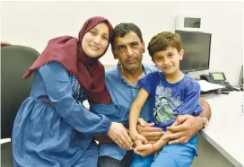  ?? ( Israel Police) ?? KARIM JUMHUR is reunited with his family in Kalansuwa near Netanya three days after being kidnapped on July 10.