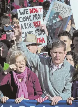  ?? STAFF PHOTO BY PATRICK WHITTEMORE ?? ‘SHOULDER TO SHOULDER’: Bay State Sen. Elizabeth Warren and Mayor Martin J. Walsh, who both spoke at the event, participat­e in yesterday’s Boston Women’s March for America.