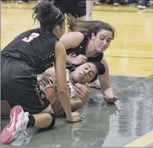  ?? Jenn march / Special to the times union ?? Guilderlan­d’s Valencia fontenelle­posson (3) and Gracie Serravillo go for the ball in the hands of Colonie’s Sareena dicerbo, center, during their sectional quarterfin­al on thursday. fontenelle­posson reached the 1,000-point plateau in the loss.