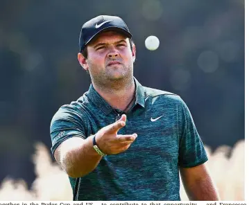  ?? — AFP ?? On a roll: Patrick Reed reacts after a putt during the first round of the HSBC Champions golf tournament in Shanghai yesterday. The American carded a 64 in blustery conditions to take the lead.