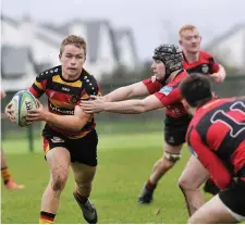  ??  ?? Sligo scrum half Ryan Feehily on the attack.