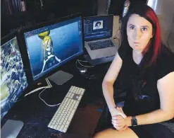  ?? —AP ?? BOSTON: In this file photo Brianna Wu, a software engineer and video-game developer, sits at her workstatio­n in Boston.