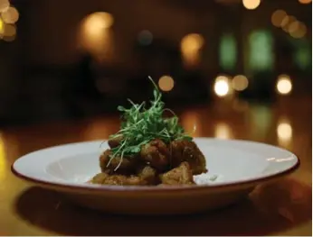  ?? COLE BURSTON/TORONTO STAR ?? Small nuggets of sweetbread­s are dusted with Moroccan spices and served with a cooling yogurt dip.