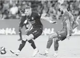  ?? REINHOLD MATAY/USA TODAY SPORTS ?? Orlando City forward Chris Mueller (9) passes the ball in front of New York City defender Maxime Chanot (4) during the first half at Orlando City Stadium.