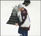  ?? Associated Press ?? Avalanche defenseman Cale Makar skates with the Conn Smythe Trophy for being the playoffs MVP in the Stanley Cup Final against the Lightning on Sunday in Tampa, Fla.