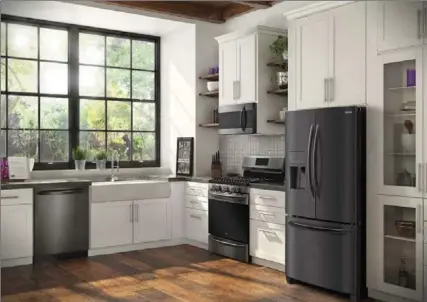  ?? FRIGIDAIRE VIA AP ?? Frigidaire’s Gallery smudge-proof, black stainless steel collection of appliances.