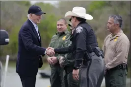  ?? EVAN VUCCI — THE ASSOCIATED PRESS, FILE ?? President Joe Biden talks with the U.S. Border Patrol and local officials as he looks over the southern border Feb. 29 in Brownsvill­e, Texas, along the Rio Grande.