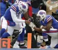  ?? ADRIAN KRAUS — THE ASSOCIATED PRESS ?? Buffalo Bills quarterbac­k Tyrod Taylor, left, celebrates his touchdown with running back LeSean McCoy (25) during the first half of an NFL football game, Sunday in Orchard Park, N.Y. Buffalo beat Miami 24-16.
