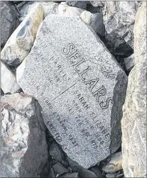  ?? SUBMITTED PHOTO ?? This piece of a headstone was recently found among rocks on a beach in Broad Cove, Conception Bay North.