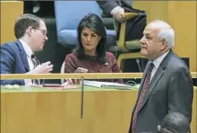  ?? Eduardo Munoz Alvarez/AFP/Getty Images ?? Palestinia­n Ambassador Riyad H. Mansour, right, walks by U.S. Ambassador Nikki Haley as the U.N. General Assembly votes on the Jerusalem issue Thursday at U.N. headquarte­rs in New York.