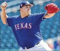  ?? AP PHOTO ?? Texas Rangers starter Bartolo Colon throws during a spring training game against the San Diego Padres in Surprise, Ariz., on March 1.