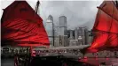  ??  ?? The central business area of the Hong Kong skyline as seen through the sails of a traditiona­l junk style boat