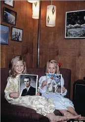  ?? Courtesy Amy Bean ?? Tracy Cernan, left, and Amy Bean hold pictures of their dads Gene Cernan and Alan Bean in 1969.